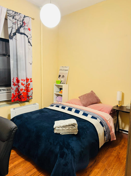 Private room in Manhattan near Central Park and the 1, B, and C trains.